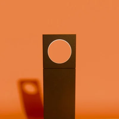 modern outdoor light with led and against orange background